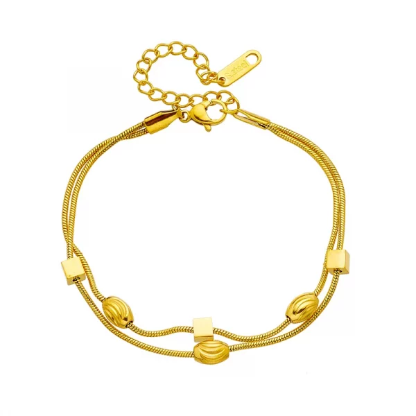 Un bracelet en acier inoxydable femme double breloque avec deux perles et une chaînette en acier inoxydable.