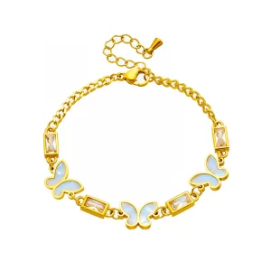 Un bracelet papillon plaqué or avec pierres blanches.