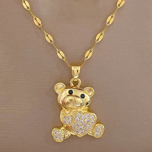 Un collier ours acier inoxydable doré ou orné d'un ours en peluche plaqué or.
